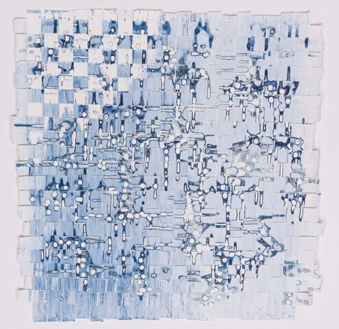woven piece made out of paper that was painted with shades of blue and white and then cut into strips and woven together to create an abstract look