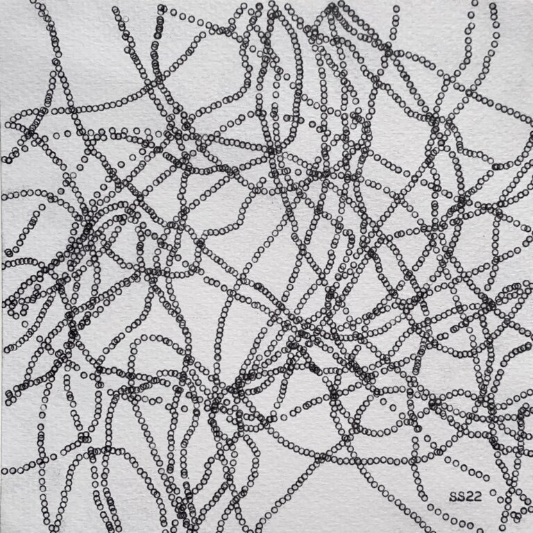 a piece made using a typewriter and little circles all connecting together that resembles a link and there are many lines of the links going all across the page in every direction and angle
