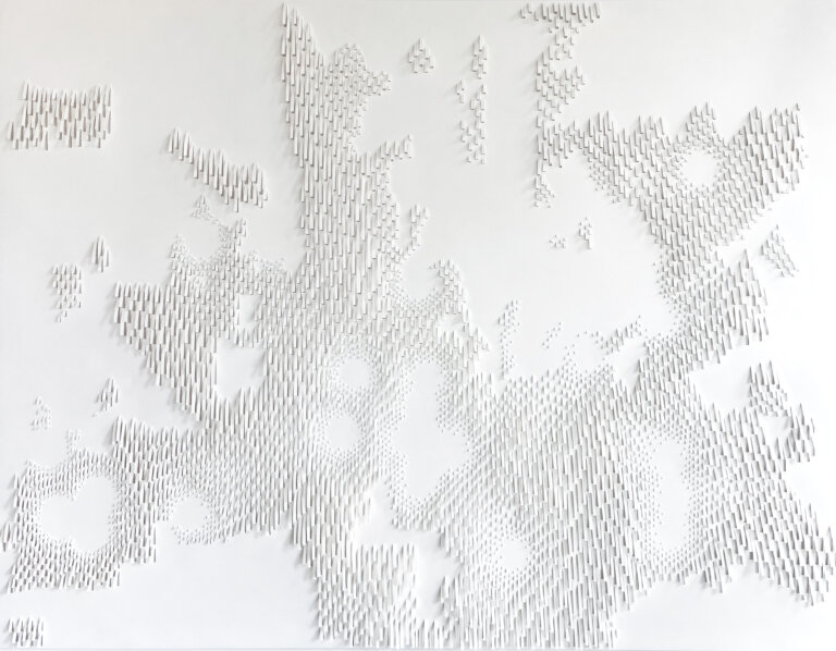 a hand cut paper relief on white paper scored with an exacto knife to produce depth and variation of texture in an organic, swaying pattern