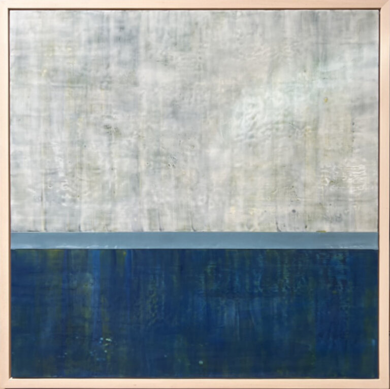 an encaustic piece where the top 2/3 is a dusty blue gray and the bottom 1/3 is a deep turquoise blue, almost navy. the two are separated by a slate blue band of color. the piece resembles a stormy sky over a deep, dark sea.