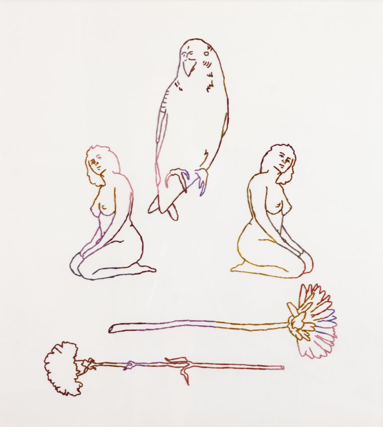 an embroidered piece with colored thread on paper. this piece feautures a large parakeet in the center top, embroidered in shades of deep burgundy, peach, purple, lavender, and red. underneath the bird are two mirrored women, kneeling and nude. the women are embroidered in gold, deep brown, burgundy, red, mauve, magenta, and pink. underneath the women are two flowers horizontal; one is a daisy and the other is a carnation. they are embroidered in pink, purple, gold, burnt orange, dark brown, burgundy, and magenta. each item is just embroidered in an outline, just to give the idea of what it is. it is not fully fleshed out.