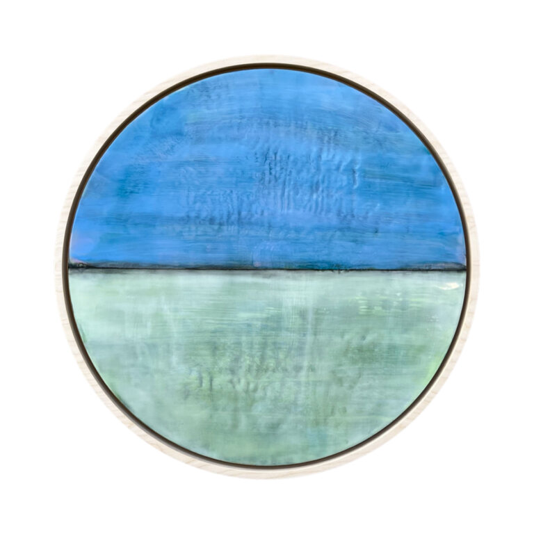 an encaustic piece on a round board where the top half is an brilliant shade of cobalt blue and the bottom half is pale aqua with a washed sap green tint
