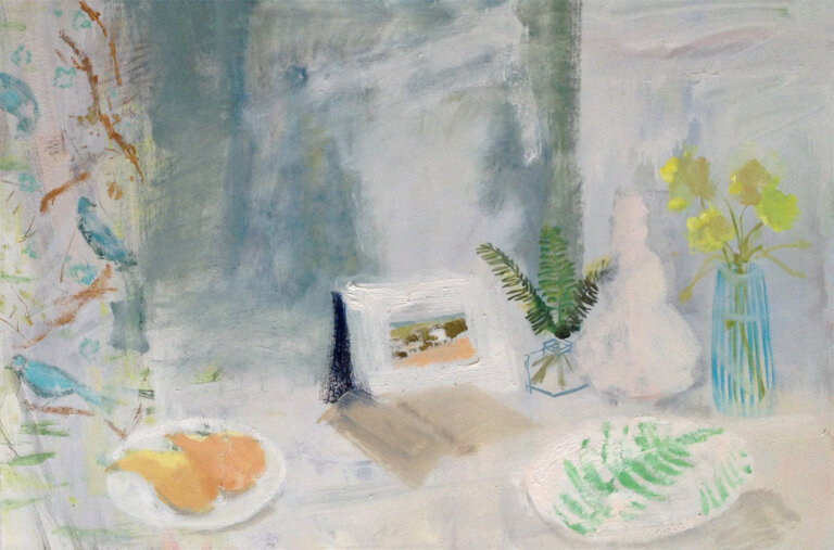 an impressionistic still life of the following items sitting inside on a hazy table: a small glass vase with three leafy branches, a blue and clear striped glass vase with a handful of yellow blossoms, a white plate with emerald green fern leaves patterned, a white picture frame with a small hazy picture in colors of olive and peach, a book with yellowed pages lying open, and a white plate with two peachy colored pears on it. there is a drape to the left of the table with a pattern of bluebirds on brown branches with green leaves