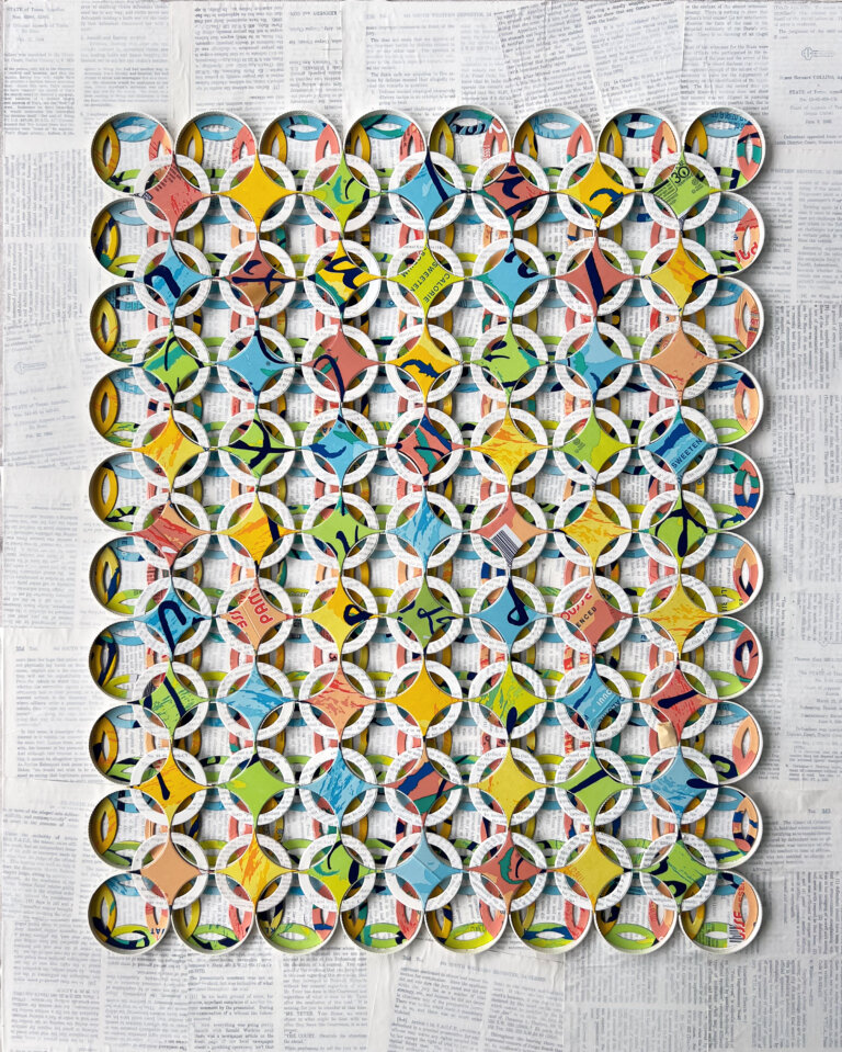 an abstract mixed media piece featuring four-pointed star shapes cut from la croix can boxes. these stars are arranged in 9 rows of 7 atop white circles cut from book pages. these are then layered on top of more circles. it has a very geometric feel, and it is titled 'circle quilt' which nods to the woven feeling of this piece. the background is layered book pages.