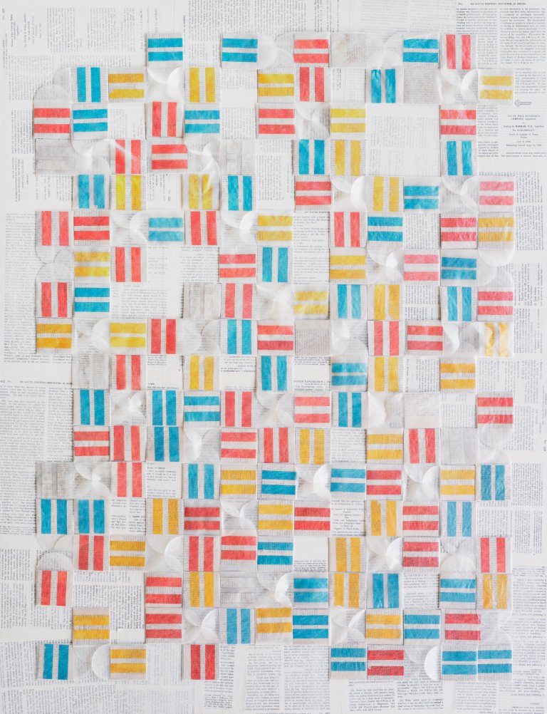 an abstract quilt-like piece constructed of evenly spaced small squares in rows. the squares are varied in design and color: some showing two parallel lines in electric blue, coral red, or lemon yellow, while some are blank white. the background is made up of pages from books covered in a thin layer of white paint