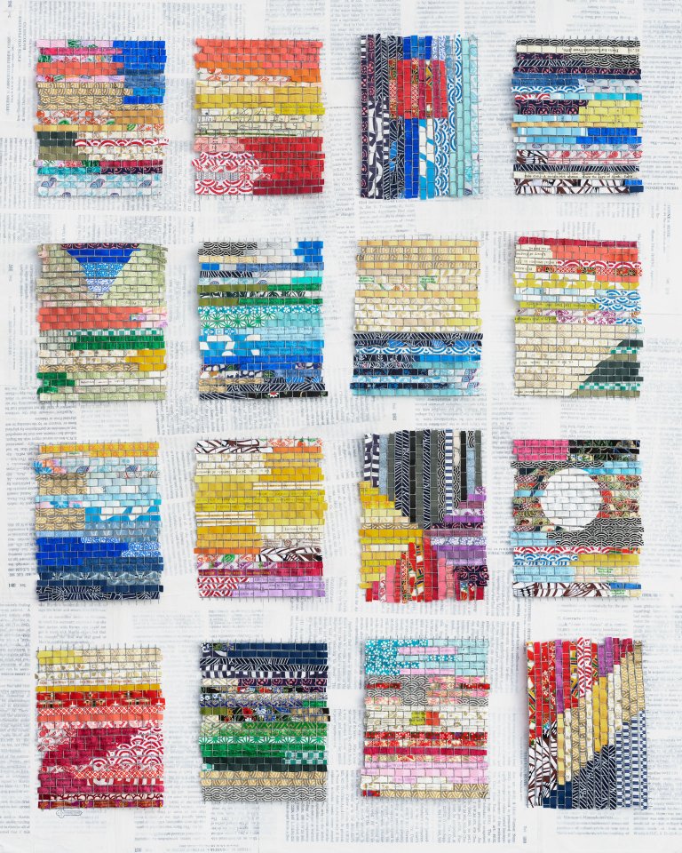 an abstract piece of art made of mixed media. there are 16 rectangles (4 rows of 4) made of woven paper in a variety of colors and patterns. the colors are mainly primary colors (reds, blues, and yellows) with a few sections of secondary colors (purples, greens, oranges). the background is a collage of book pages with a thin layer of white paint over top.
