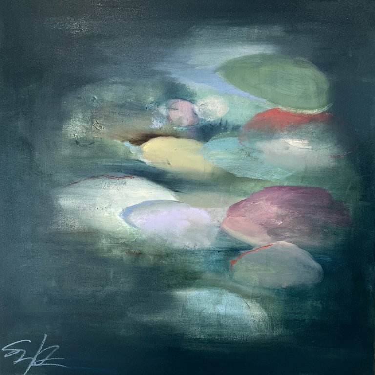 an abstract art piece with an indigo background and hazy oval shapes in the foreground in soft greens, yellows blues, and peach