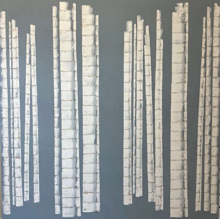 an abstract art piece featuring aspen tree trunks in white with gold detailing against a flat slate blue background