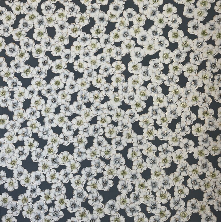 an abstract floral piece of white blossoms with green and blue centers against a slate background. there are gold accents on the flower petals and centers