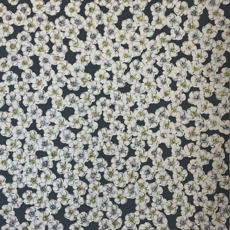 an abstract floral piece of white blossoms with green and blue centers against a slate background. there are gold accents on the flower petals and centers