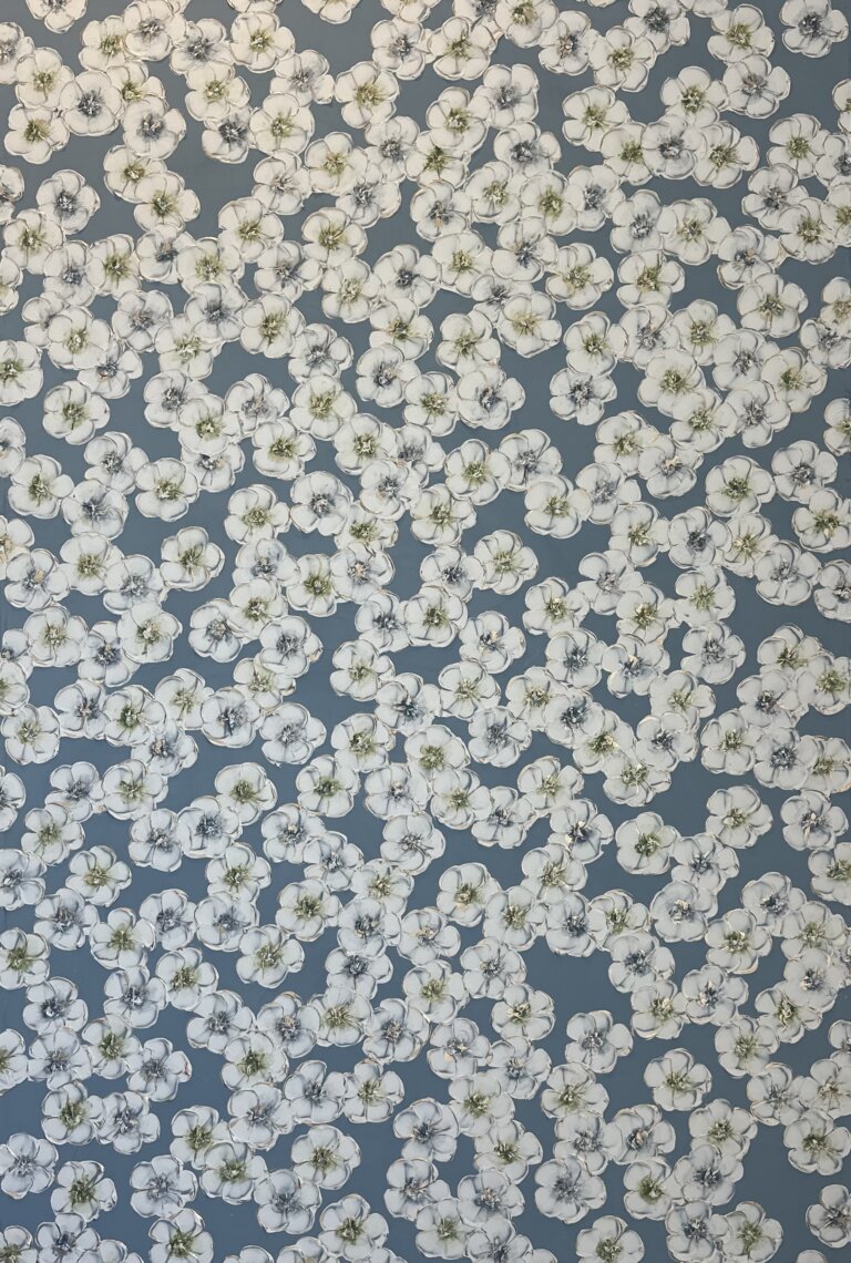 an abstract floral piece of white blossoms with green and blue centers against a muted blue background. there are gold accents on the flower petals and centers