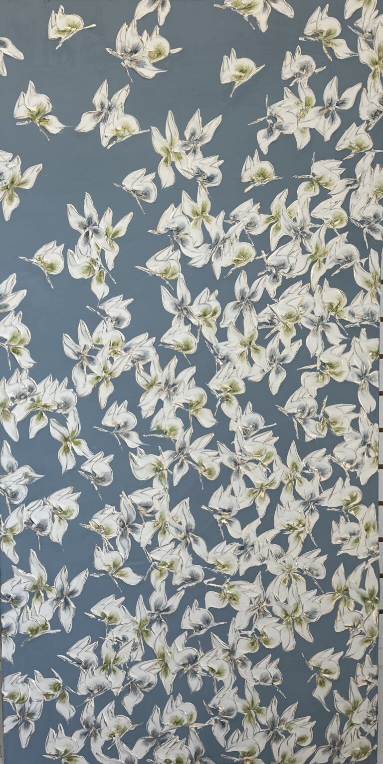 an abstract piece of white butterflies with green and blue centers against a slate background