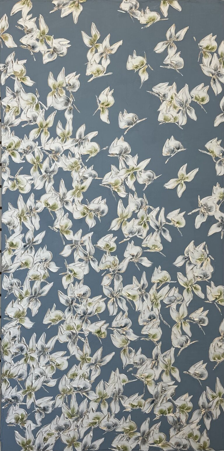 an abstract piece of white butterflies with green and blue centers against a slate background
