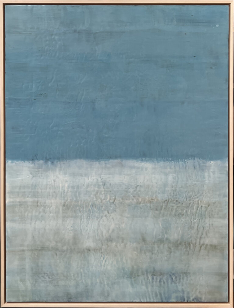 an abstract encaustic piece that is divided horizontally into two sections. the top section is a slate blue, and the bottom is a light gray color.