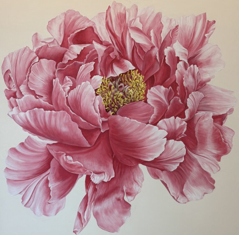a large pink peony with fluffy petals and a yellow center against a cream colored background