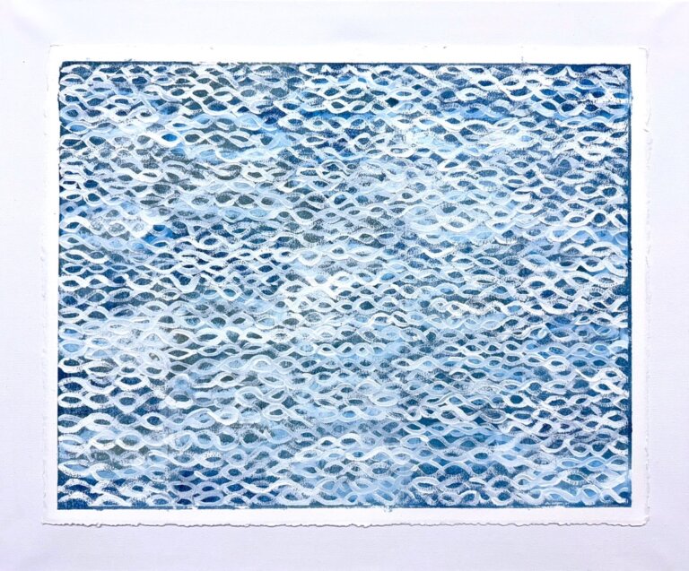 an abstract piece that has a pattern of fish-like scales in white against a background of mixed blues and indigo