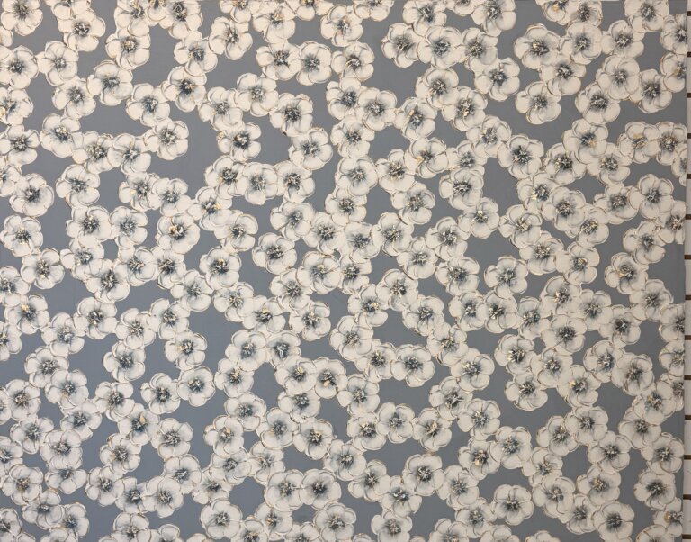 an abstract art piece with a dark blue background and a foreground of scattered white fluffy flowers with green and indigo centers. there is gold detailing on the petals of the flowers