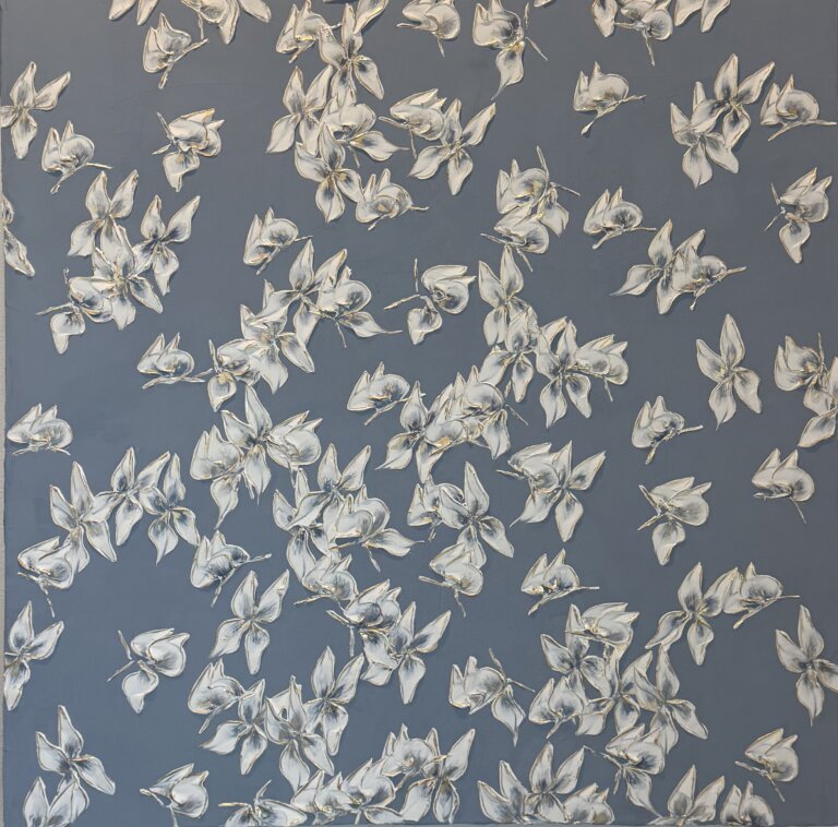 an abstract piece of white butterflies with indigo centers against a slate background