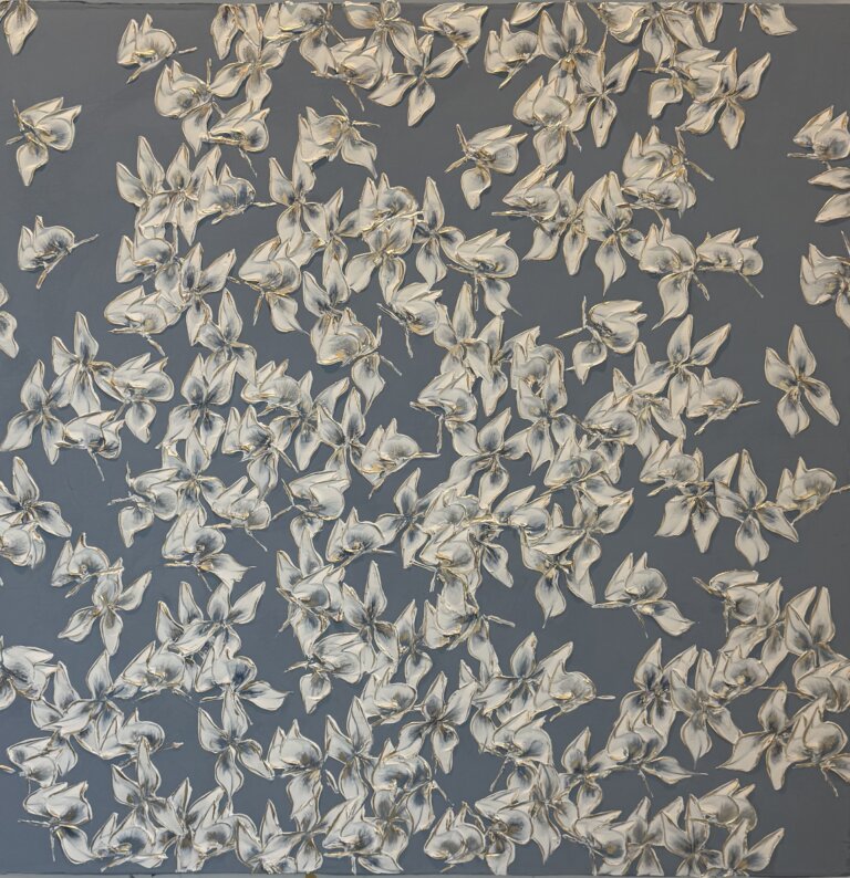 an abstract piece of white butterflies with indigo centers against a slate background