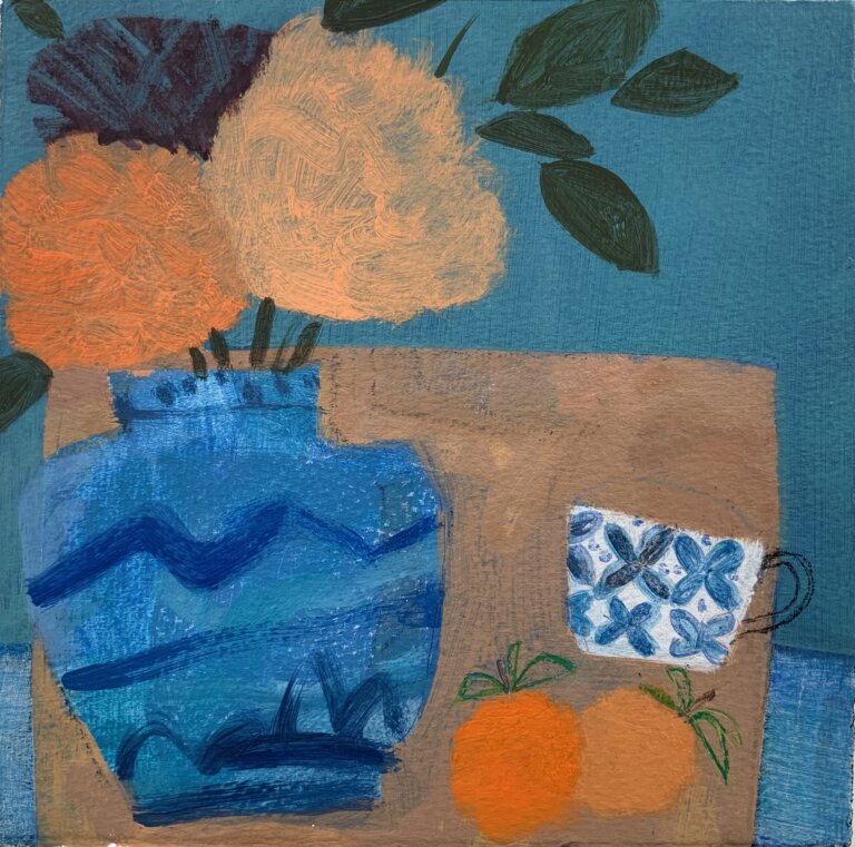 a simplified still life showing a brown table against a brilliant blue background. there is a blue vase with orange flowers in it on the table, and a small white mug with blue flowers painted on it. there are two oranges resting on the table