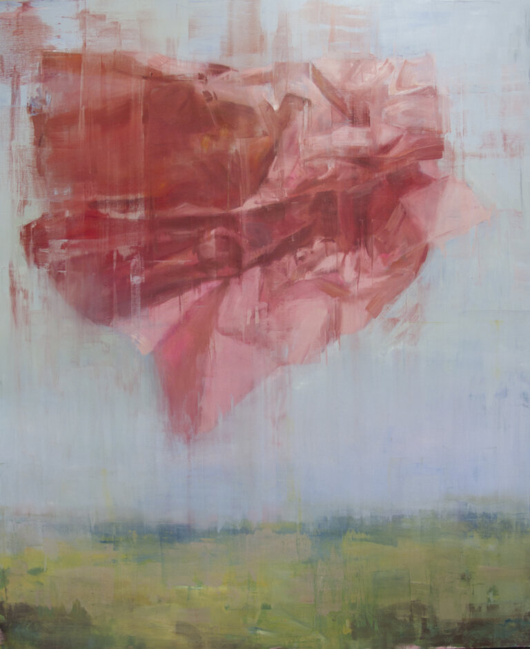 an abstract landscape with a soft blue sky above a green ground accented with dark green colored shrubbery. there is a pink and red shape floating in the center of the sky that looks like it is created with folded, crumpled paper