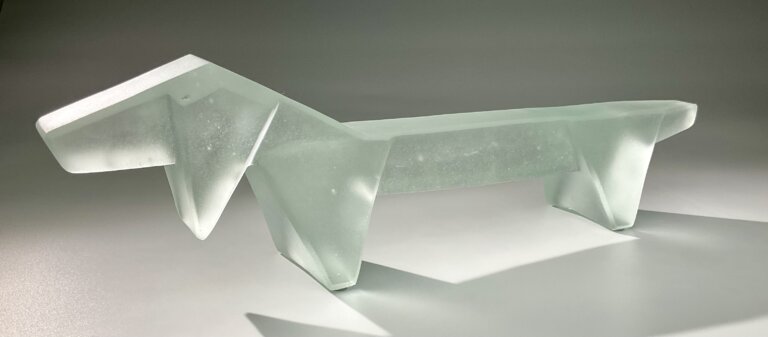 a hand cast clear glass interpretation of a dachshund