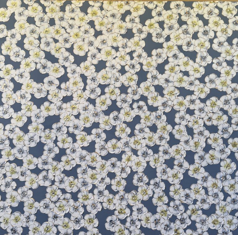 an abstract piece of round white flowers with indigo and chartreuse centers against a slate blue background