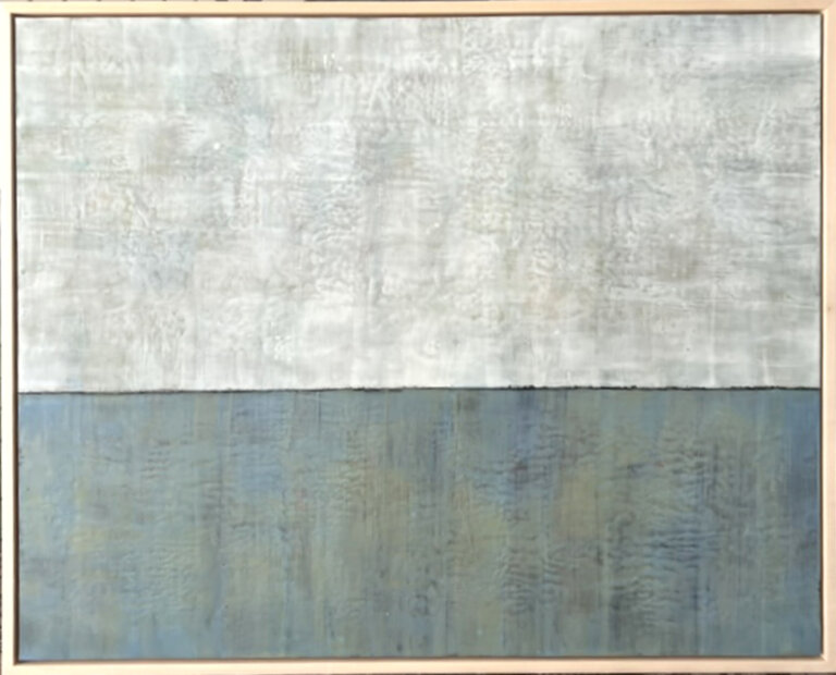 an abstract encaustic piece that is divided horizontally into two sections. the bottom section is slate blue with yellow and brown accents, and the top is off-white with gray accents. where the two sections meet there is a thin black line