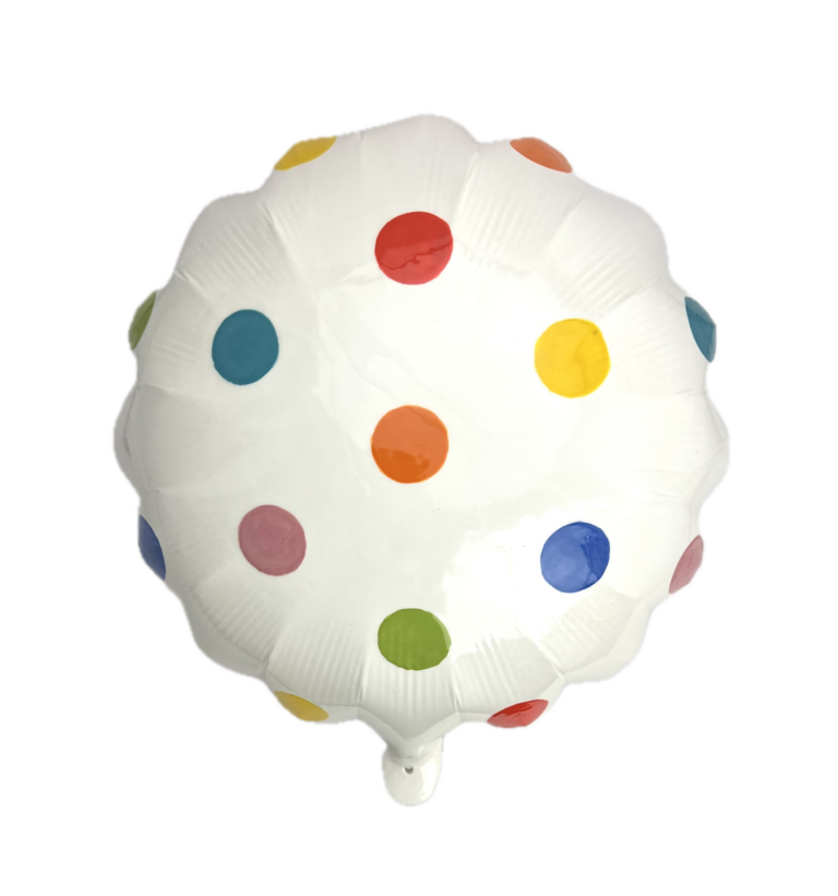 white ceramic round balloon with multi colored dots spread evenly on it.