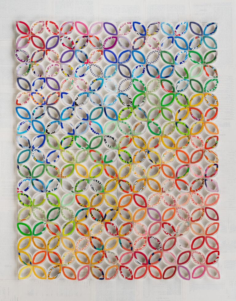 collage of white condiment cups with multi colored candy box petal outline cut outs on top of the cups