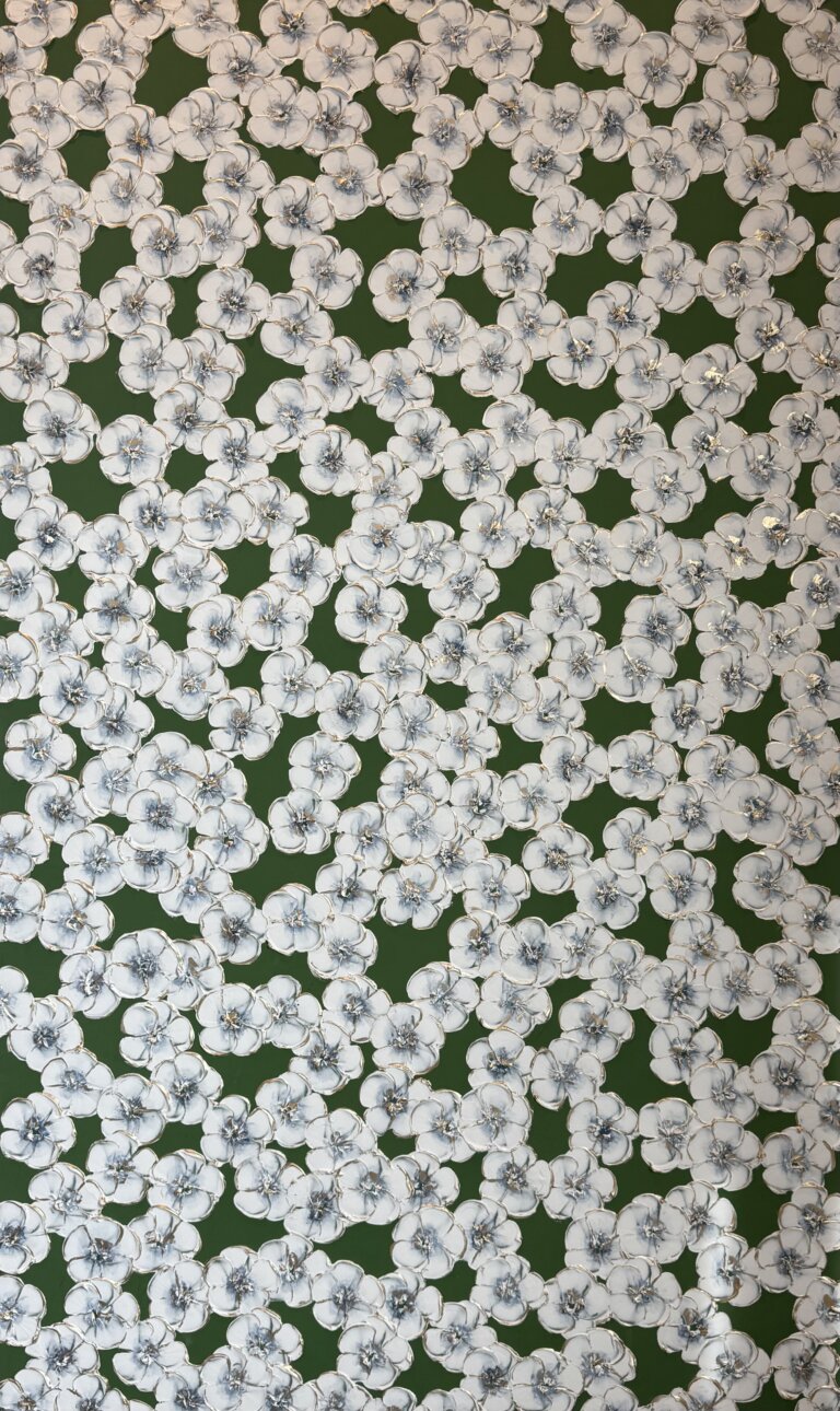 an abstract art piece with a dark green background and a foreground of scattered white fluffy flowers with slate colored centers. there is gold detailing on the petals of the flowers